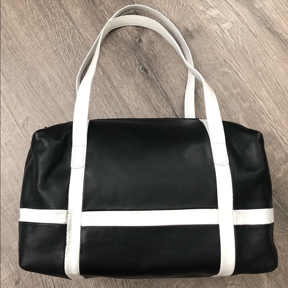 Andrew Marc black/white leather duffle style bag